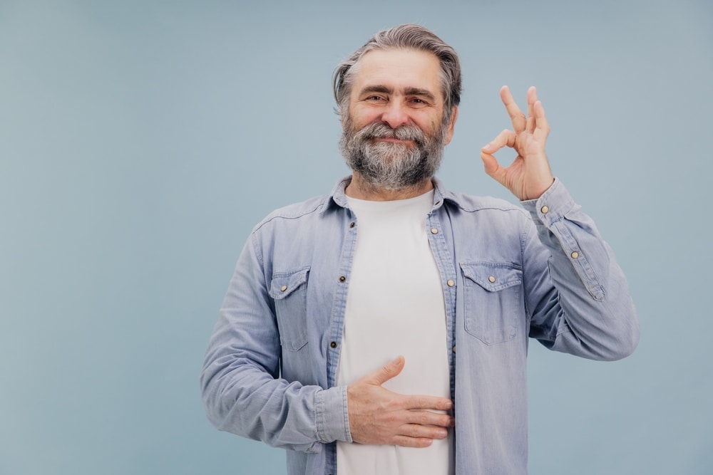 Grey,Haired,Bearded,Senior,Man,In,Casual,Clothes,Touching,His